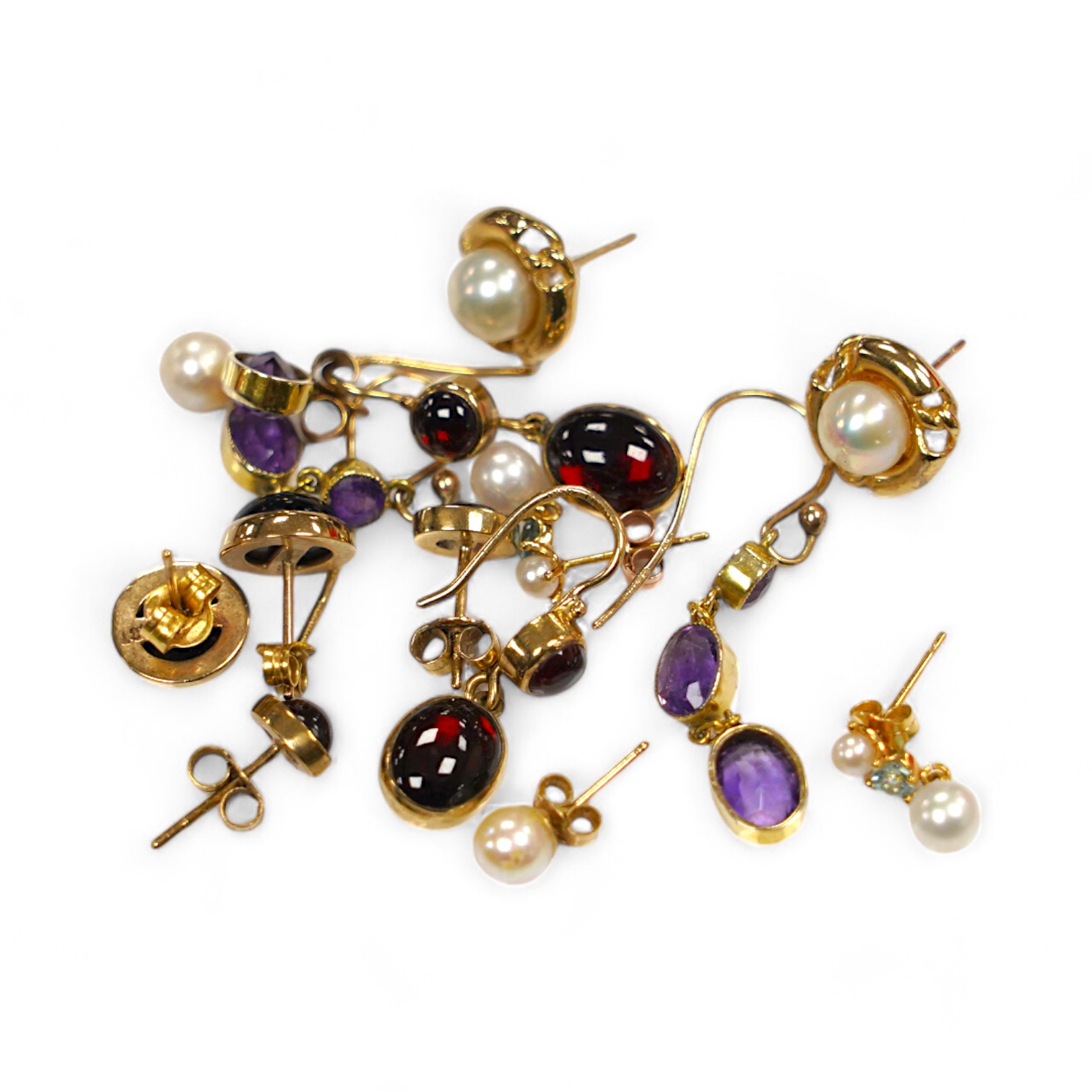 Five assorted modern pairs of 9ct and gem set earrings, including garnet and two other pairs of yellow metal and gen set earrings. Condition - fair to good